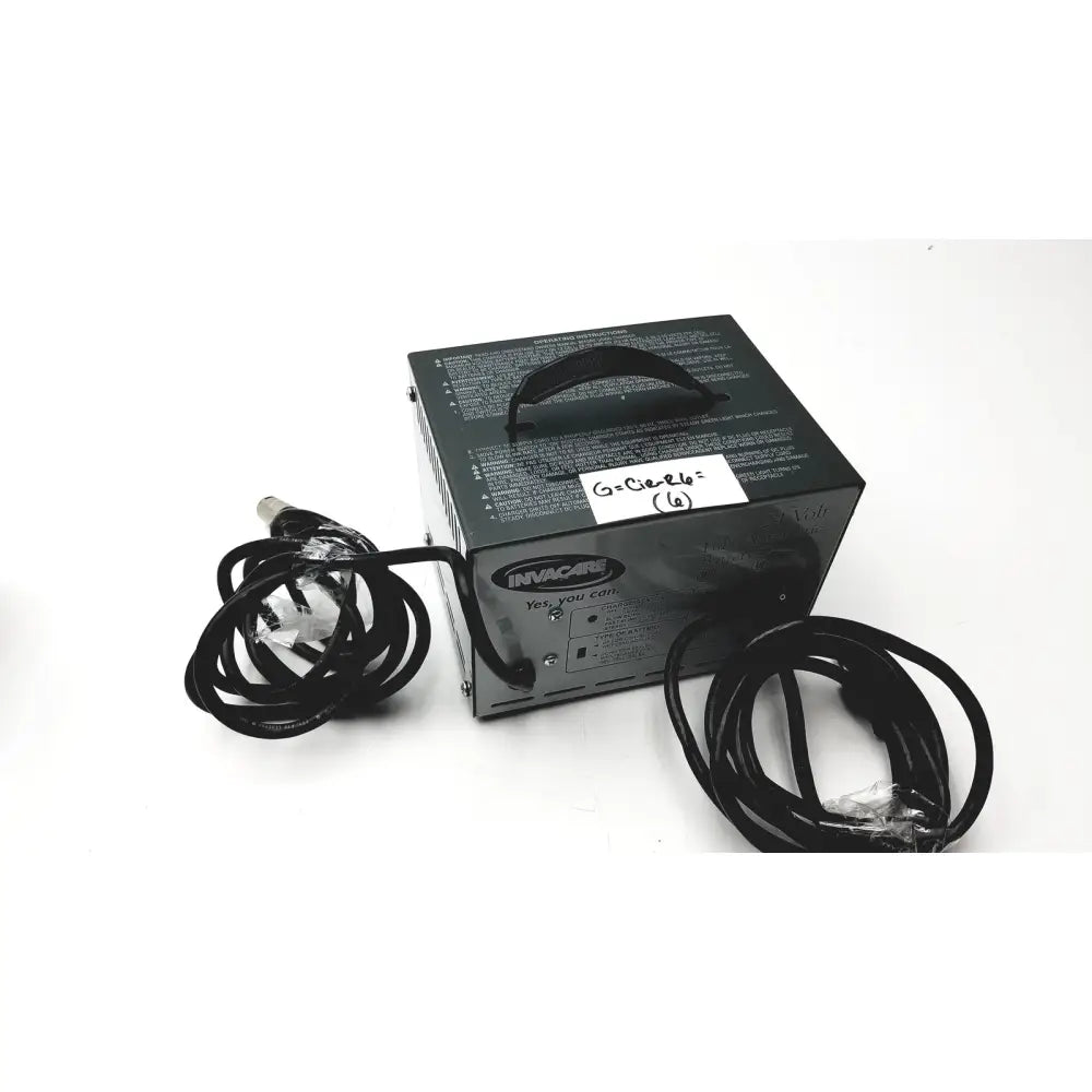 Black invacare wheelchair 24 volt automatic battery charger with coiled power cords and top handle serial no 460300646