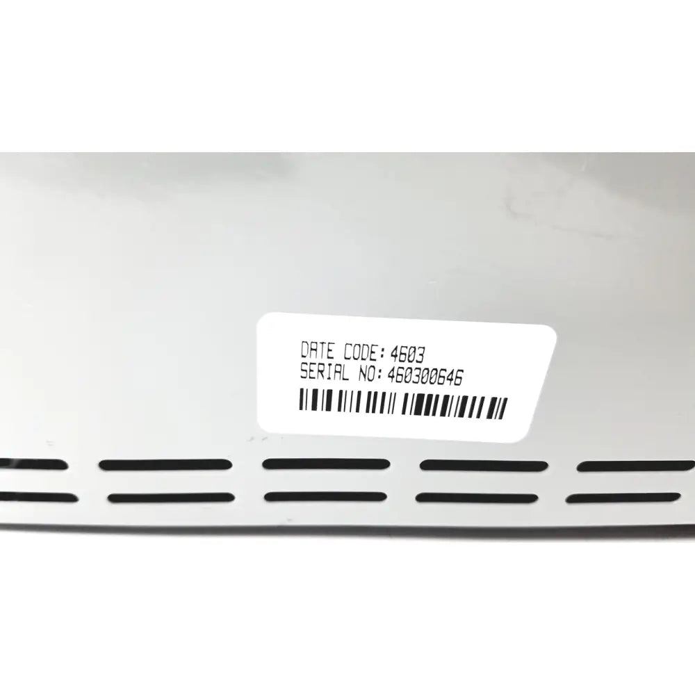 White rectangular label with black text and barcode on white surface of invacare wheelchair 24 volt automatic battery charger