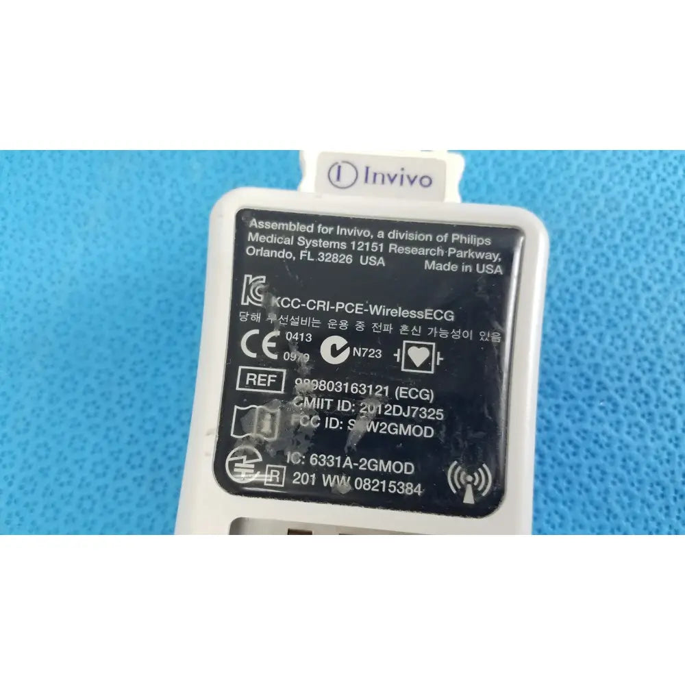 White plastic wireless ecg module by invivo medical labeled kcc-cri-pce-wirelessecg with certification marks