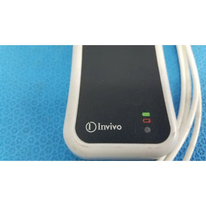 White and black invivo medical wireless ecg module with leads cable featuring green power indicator light