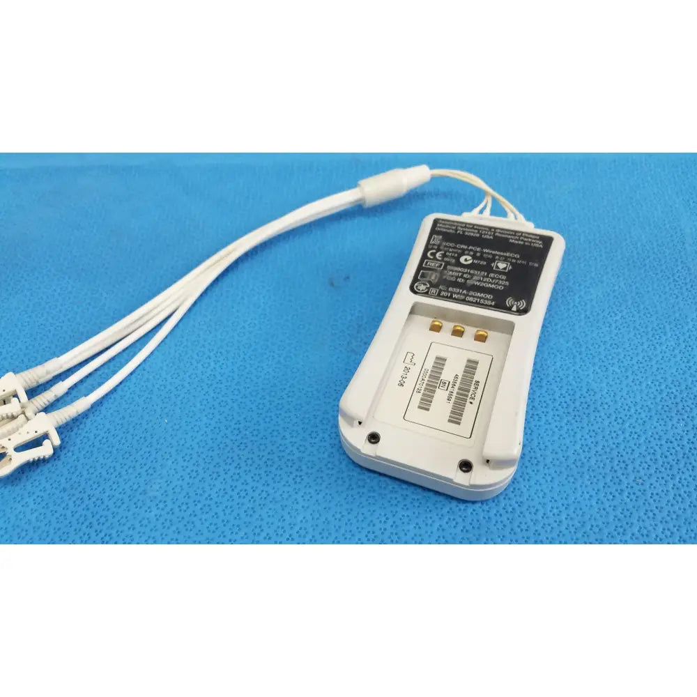White plastic wireless ecg module with three white cables and connectors by invivo medical for cardiac monitoring