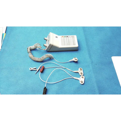 White rectangular iontophoretic drug delivery device phoresor ii pm700 with coiled silver cable and multiple electrodes