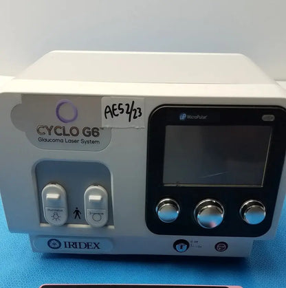 White iridex cyclo g6 ophthalmic laser console with black control panel and silver knobs for glaucoma treatment