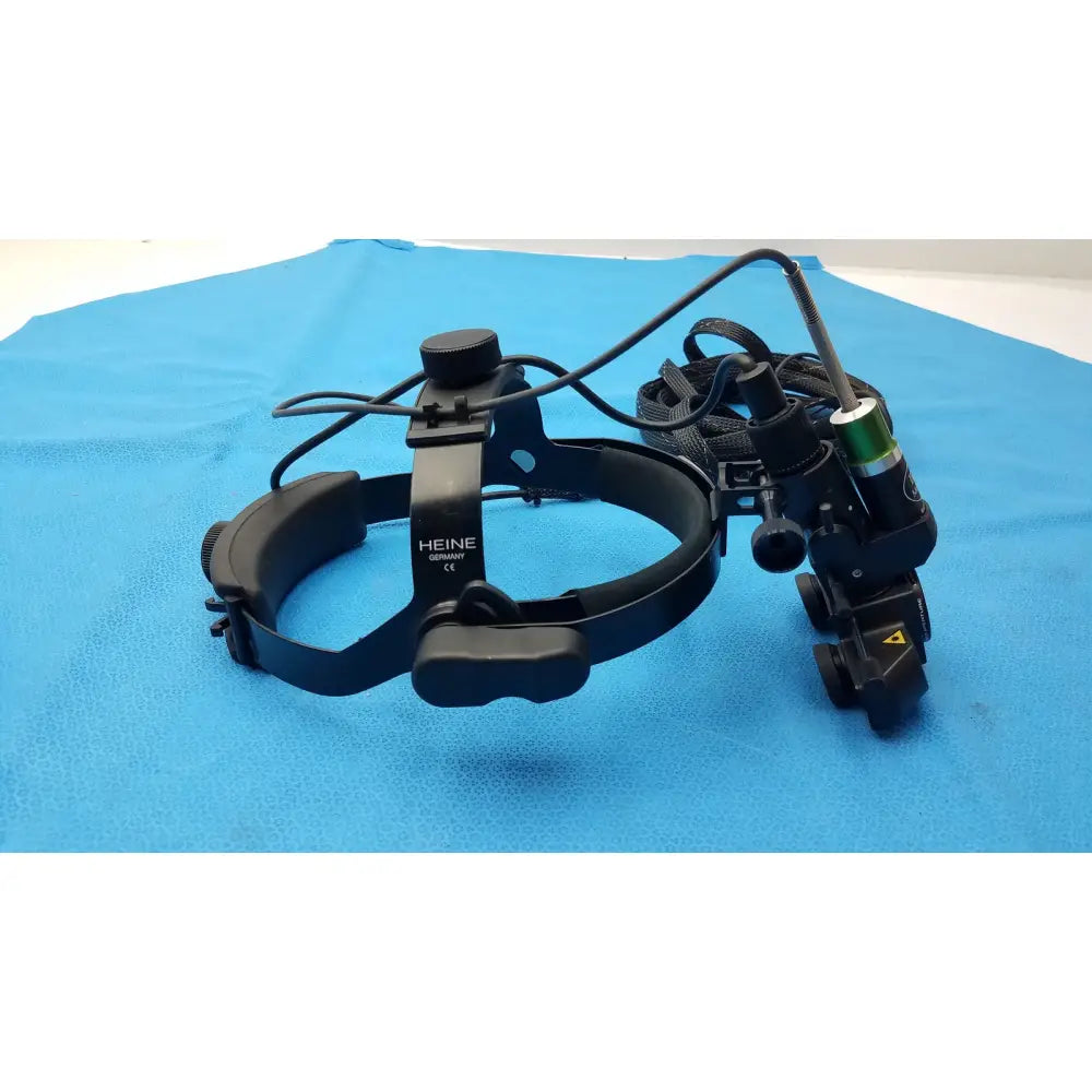 Black heine germany head-mounted iris medical laser indirect ophthalmoscope with adjustable arms and green battery