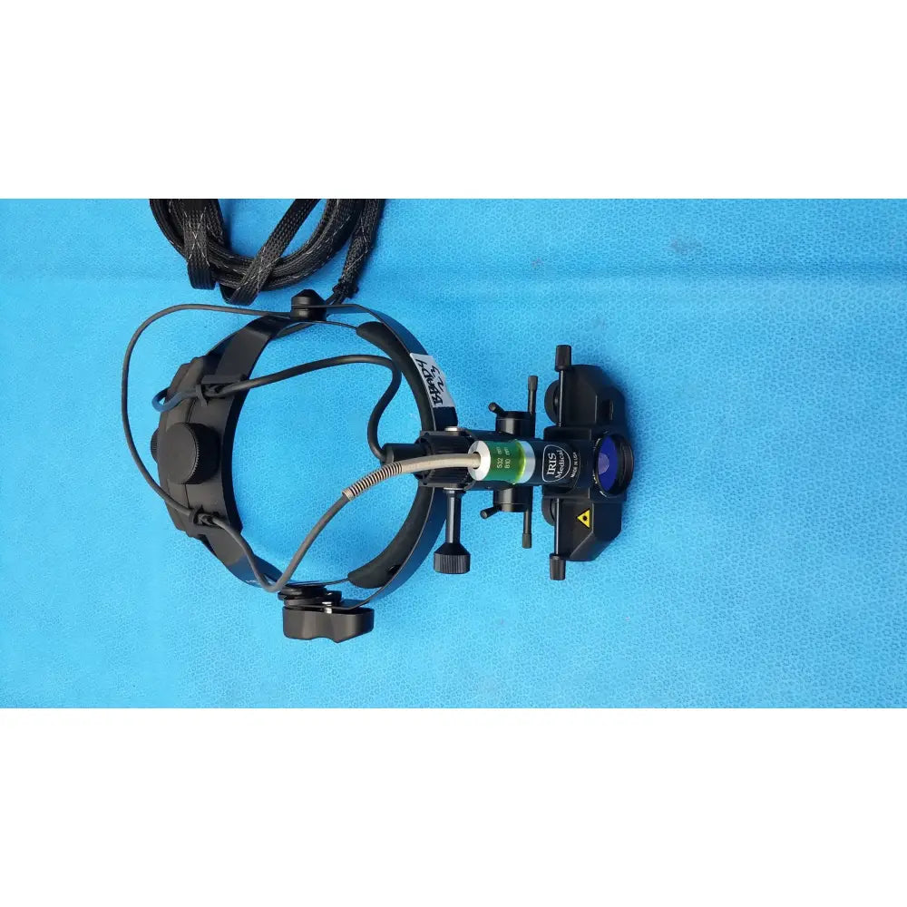Black surgical headlamp with adjustable arms and green-labeled lens housing for iris medical laser indirect ophthalmoscope