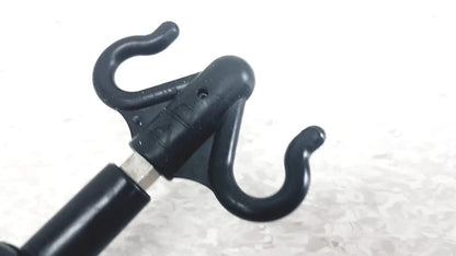 Black plastic hook attachment with two curved hooks and central mount for iv pole compatible with hillrom p2217a reuse medical