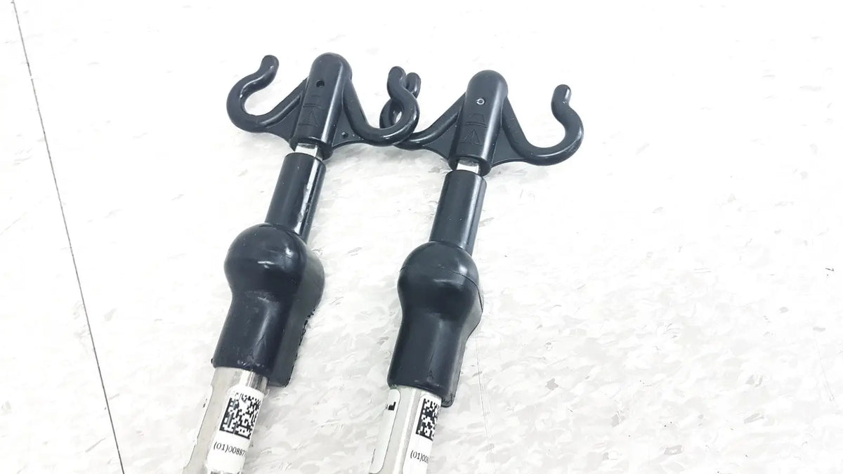 Black plastic hook attachments with matte finish and curved hooks for reuse medical iv pole compatible with hillrom p2217a p2217a