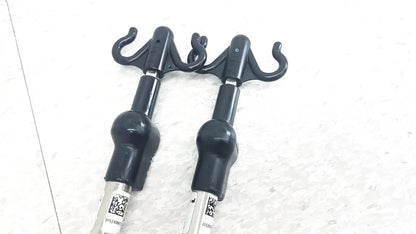 Black plastic hook attachments with matte finish and curved hooks for reuse medical iv pole compatible with hillrom p2217a p2217a