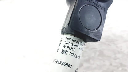 Black plastic iv pole compatible with hillrom p2217a featuring white label with product reference and reuse medical details