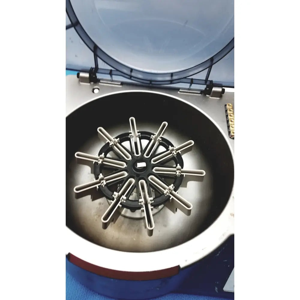 J&J Ortho-Clinical Diagnostic IVD ortho workstation with a metallic centrifuge rotor featuring twelve u-shaped tubes