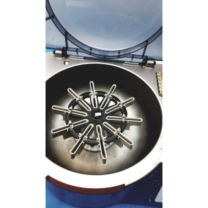 J&J Ortho-Clinical Diagnostic IVD ortho workstation with a metallic centrifuge rotor featuring twelve u-shaped tubes