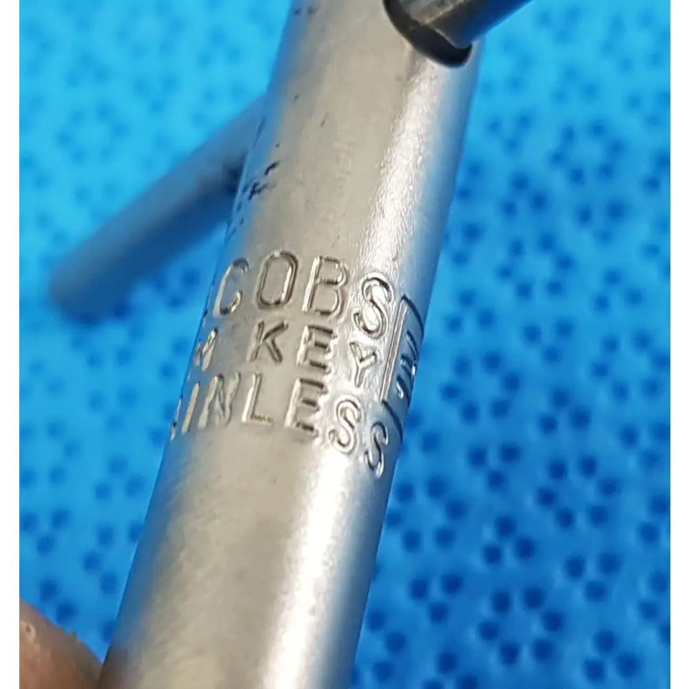 Silver-colored jacobs kim key 1m stainless precision chuck key made of stainless steel with engraved branding for drill systems