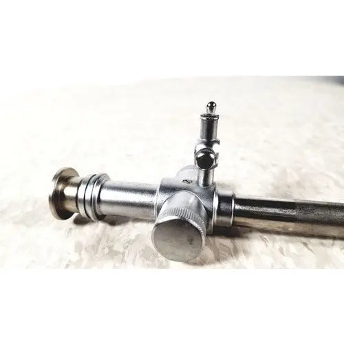 Jarit 600-440 silver metallic piston valve cannula with cylindrical body, threaded ends, and central adjustment knob