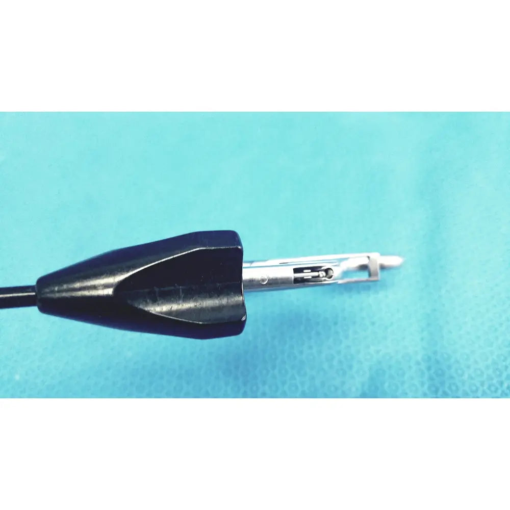 Jarit 610-140 roto-lok stainless steel clamp with black plastic handle and articulated metallic tip for surgical use