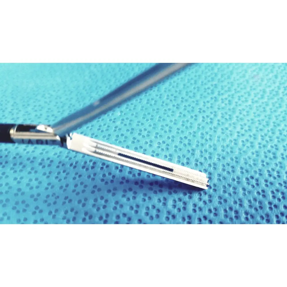 Jarit 610-140 Roto-Lok stainless steel clamp with silver serrated blade and black handle steel clamp instrument