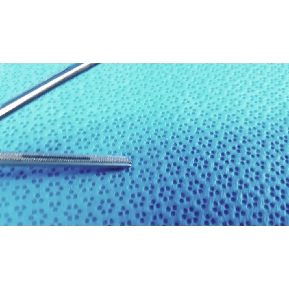 Silver Jarit 610-140 roto-lok stainless steel surgical instrument with textured tapered tip on blue perforated surface
