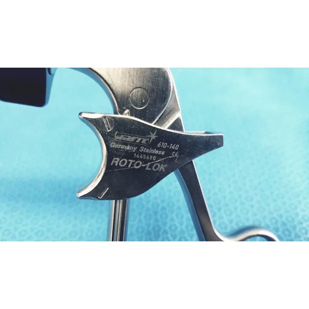 A sleek metallic jarit 610-140 stainless steel roto-lok surgical instrument with engraved hart germany markings