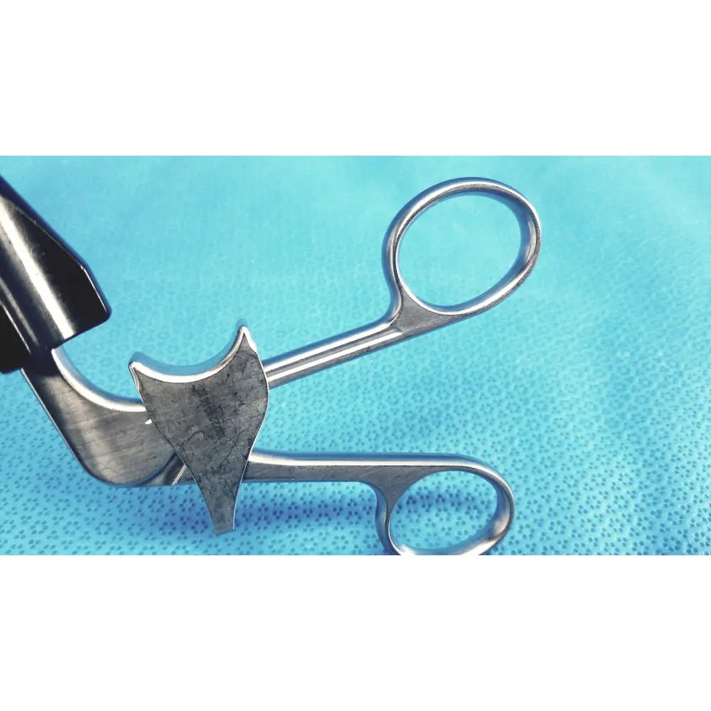 Silver stainless steel roto-lok surgical clamp with curved toothed jaw and rounded handles jarit 610-140