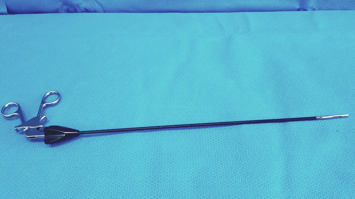 Black-handled jarit 610-140 stainless steel roto-lok surgical instrument with scissor-like jaws and slender shaft