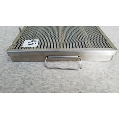 Jarir stainless steel 37988a perforated sterilization tray with rectangular handle and white 64 label on side