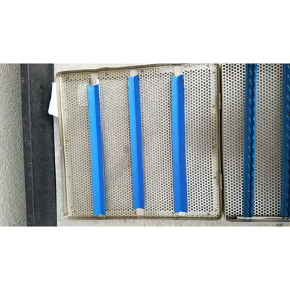 Blue plastic strips affixed to a perforated jarit stainless steel 37988a sterilization case grid panel