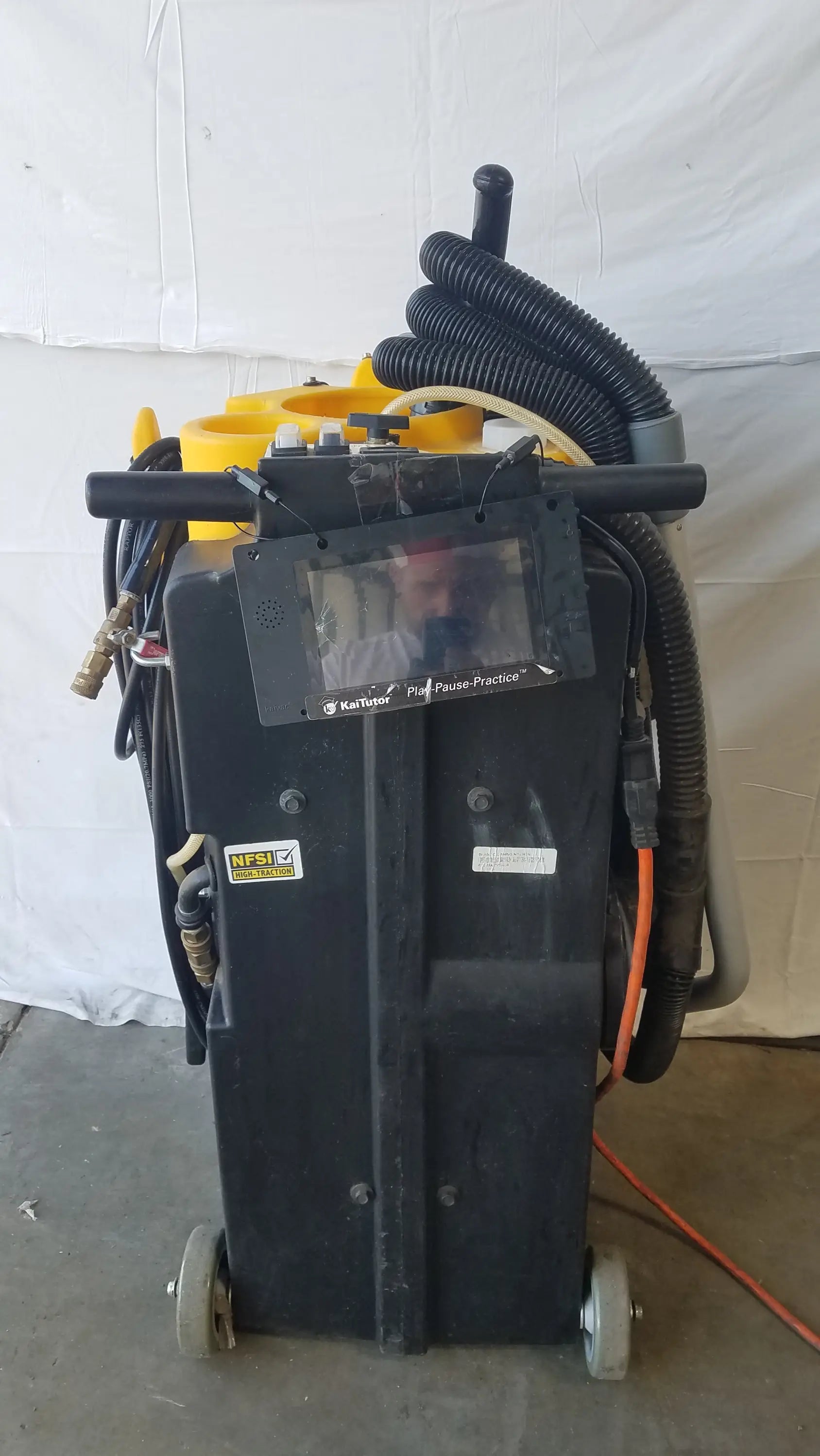 Kaivac wet dry vacuum cleaning system black wheeled industrial machine with yellow components and mounted monitor