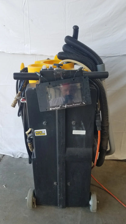 Kaivac wet dry vacuum cleaning system black wheeled industrial machine with yellow components and mounted monitor