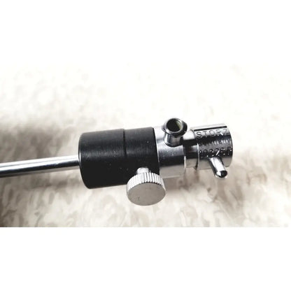 Silver and black metal medical instrument with textured knob featuring storz germany branding for storz 10326f adult use