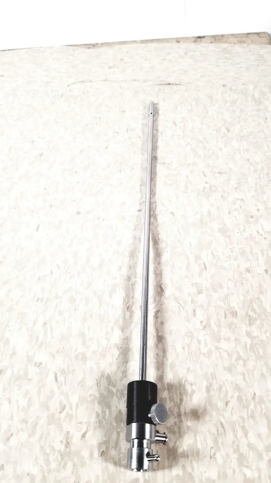 Silver surgical retractor with black handle and adjustment knob in karl storz 10326f adult optical stylet sheath product