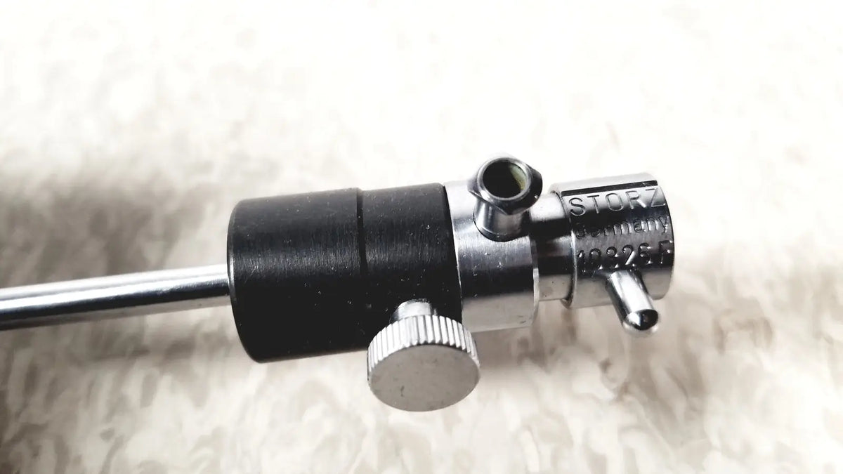 Silver and black metal medical instrument with textured knob featuring storz germany branding for storz 10326f adult use
