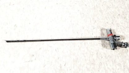Black metal storz 10338c surgical bronchoscope sheath with long slender shaft and red-accented complex handle assembly