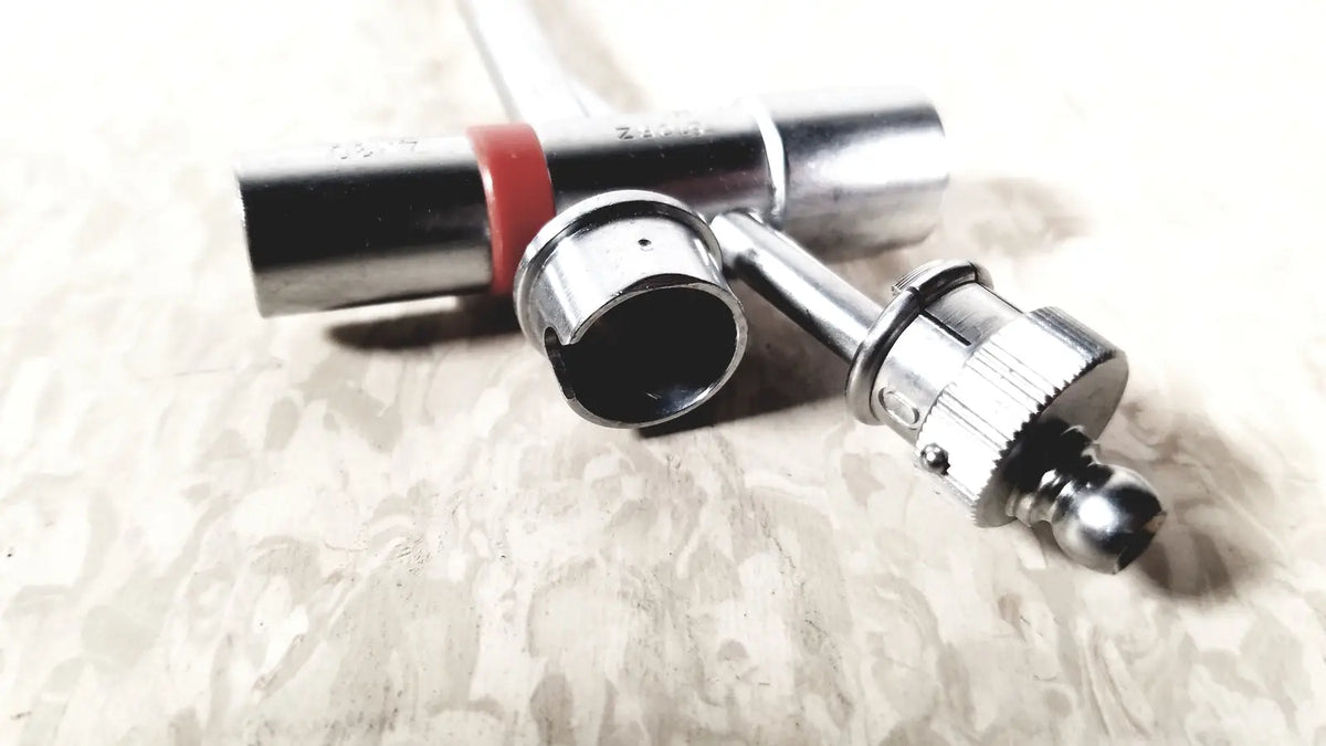 Silver-colored metal xlr audio connectors with red band and threaded locking on the back of karl storz 10338c surgical bronchoscope sheath