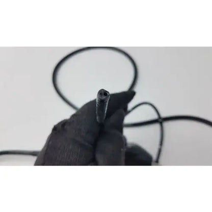 Black rubber-coated cable end with threaded metal tip of karl storz storz 11272vnu flexible video endoscope back side