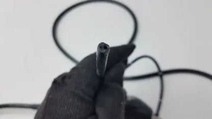 Black rubber-coated cable end with threaded metal tip of karl storz storz 11272vnu flexible video endoscope back side