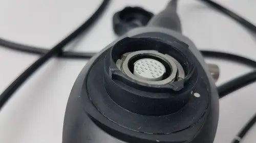 Black karl storz 11272vnu flexible video endoscope with circular textured lens port and metallic ring detail