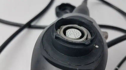 Black karl storz 11272vnu flexible video endoscope with circular textured lens port and metallic ring detail