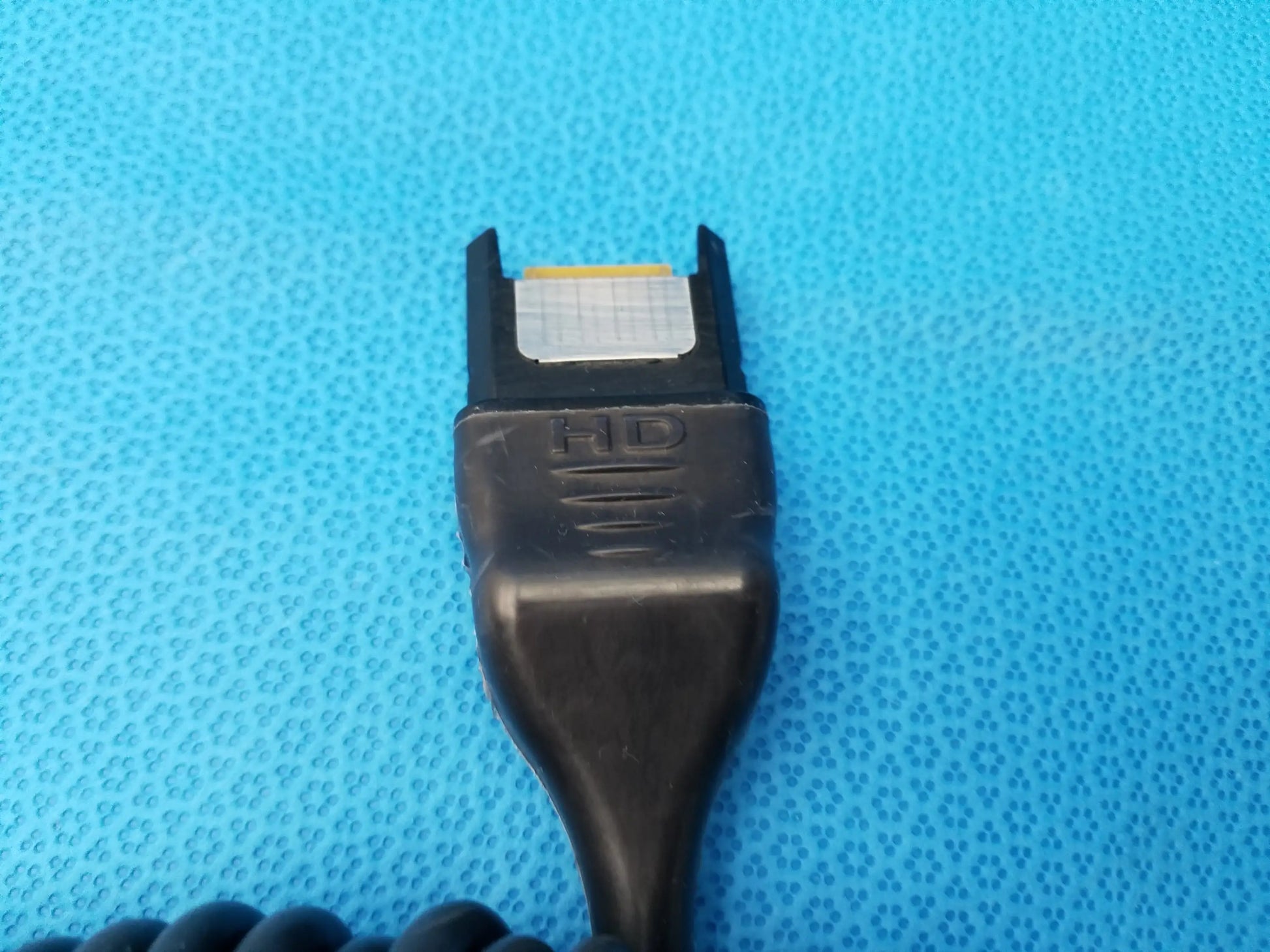 Black hd karl storz camera head connector with coiled cable and metallic contact plate precision imaging component