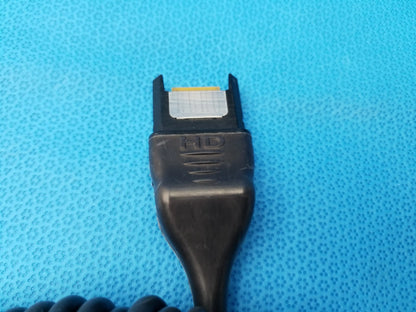 Black hd karl storz camera head connector with coiled cable and metallic contact plate precision imaging component