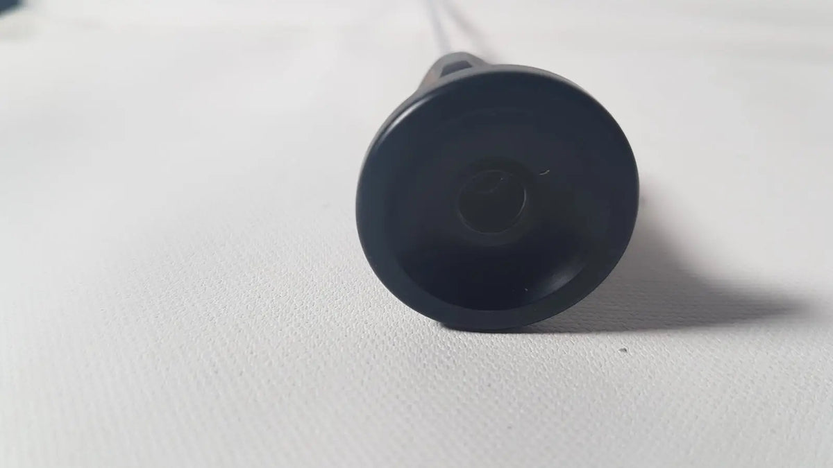 Black plastic suction cup with smooth rounded surface and tapered base for karl storz 70 degree cystoscope reuse medical device