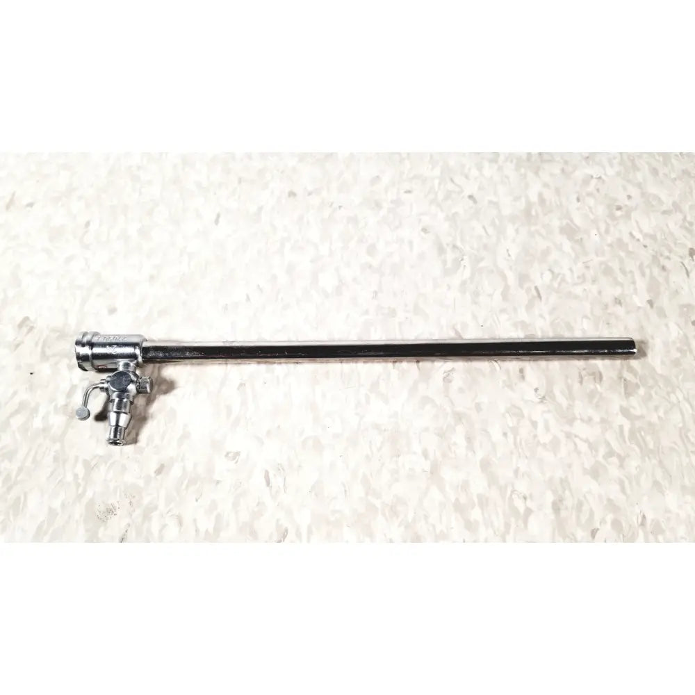 Silver-colored metal storz 27090j endoscope with long slender shaft and complex control mechanism at one end