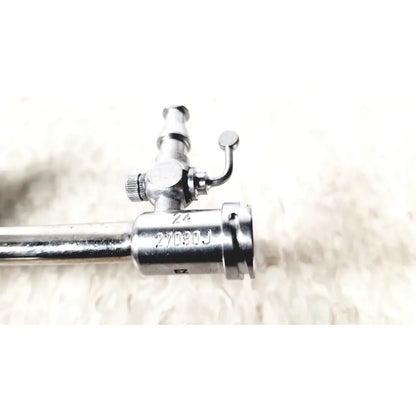 Silver karl storz 27090j endoscope obturator with cylindrical shaft and engraved valve mechanism markings