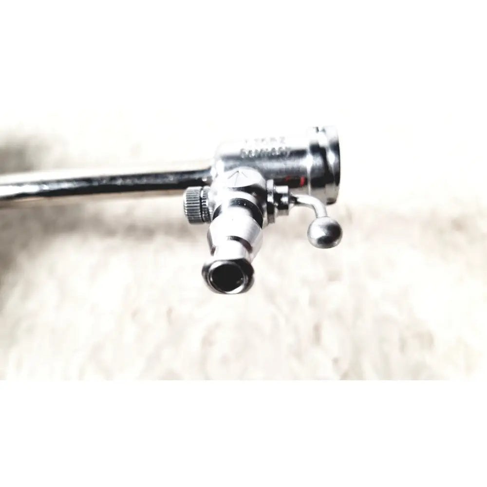 Silver metallic karl storz 27090j endoscope obturator with cylindrical handle and articulated joints for surgical use