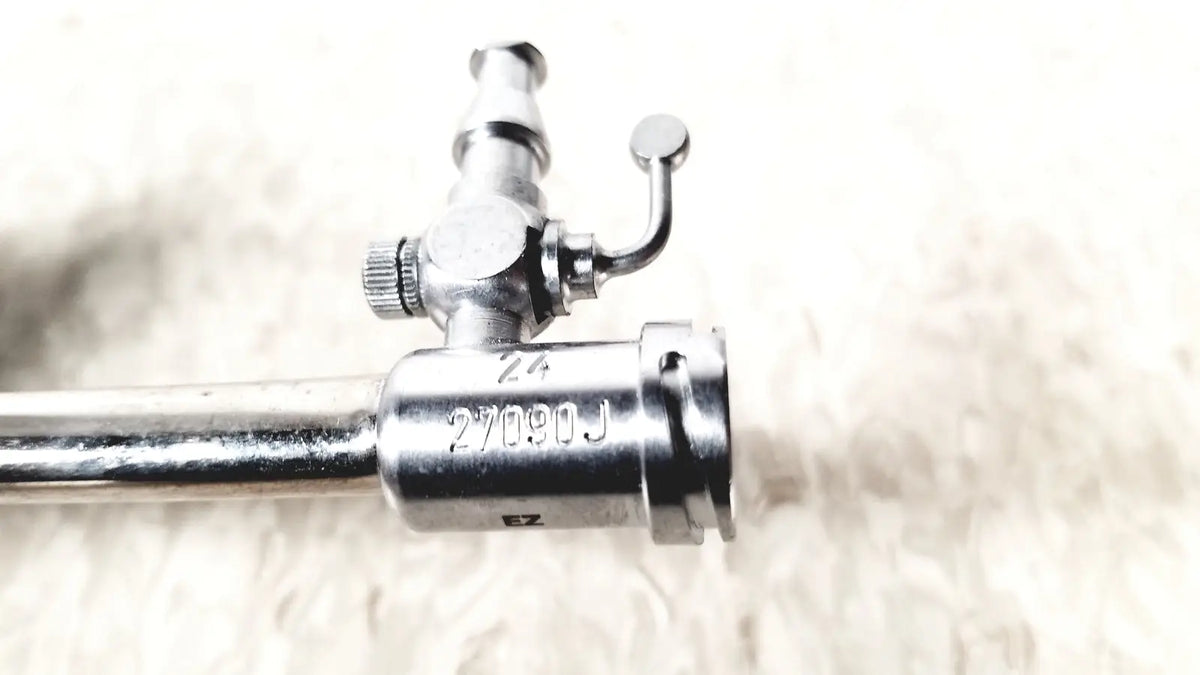 Silver karl storz 27090j endoscope obturator with cylindrical shaft and engraved valve mechanism markings