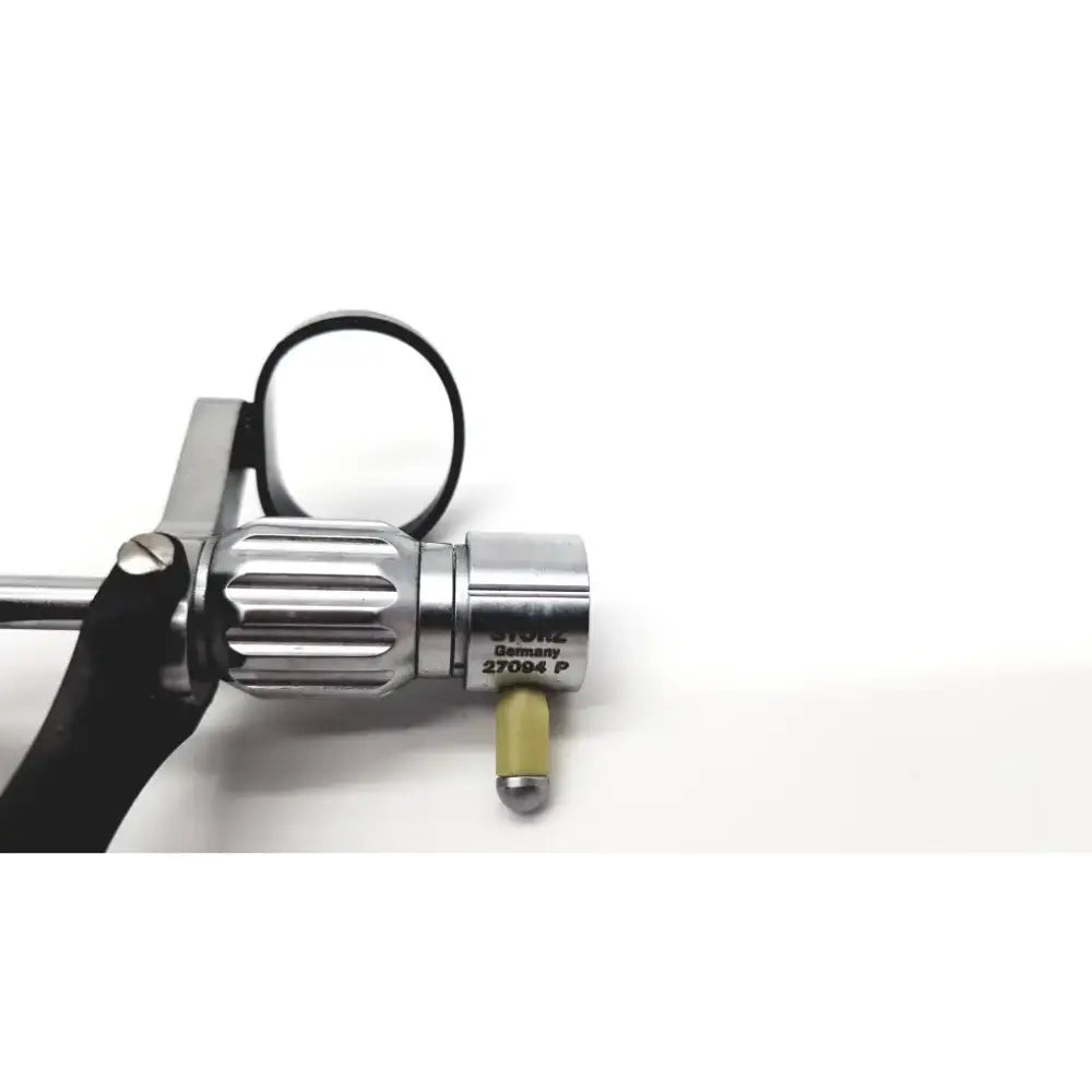 Silver metallic karl storz 27094p optical kidney stone grasper with textured grip and black handle featuring engraved branding