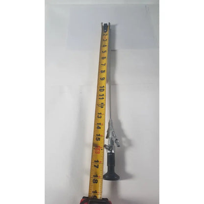 Silver karl storz 27410 sk 7.5fr autoclavable rigid scope dual channel with black grip and articulated joints alongside yellow measuring tape