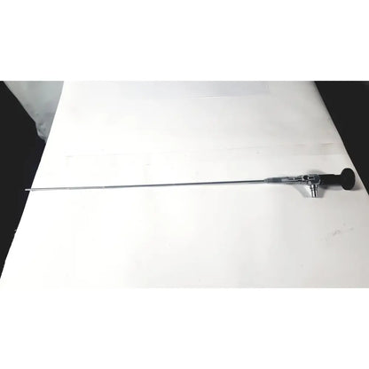 A sleek metallic karl storz 27410 sk 7.5fr autoclavable rigid scope dual channel with black ergonomic handle and silver shaft