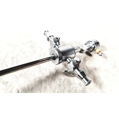 Silver metallic storz 28124cr cannula surgical sheath with dual rotating stopcocks and multiple knobs and ports