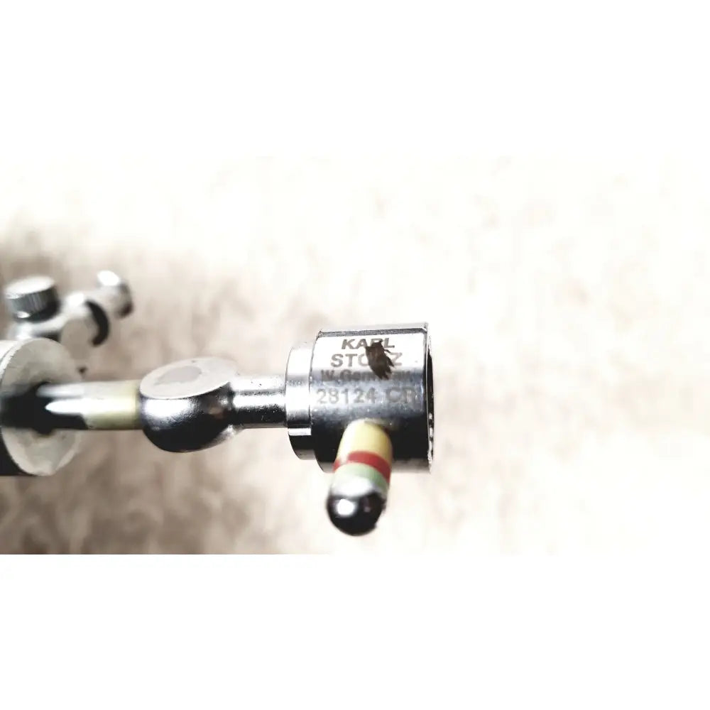 Metallic karl storz 28124cr cannula with dual rotating stopcocks and striped cylindrical tip surgical sheath