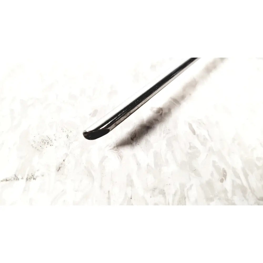 A sleek black metal crochet hook with polished finish and curved tip shown alongside karl storz 28124cr cannula