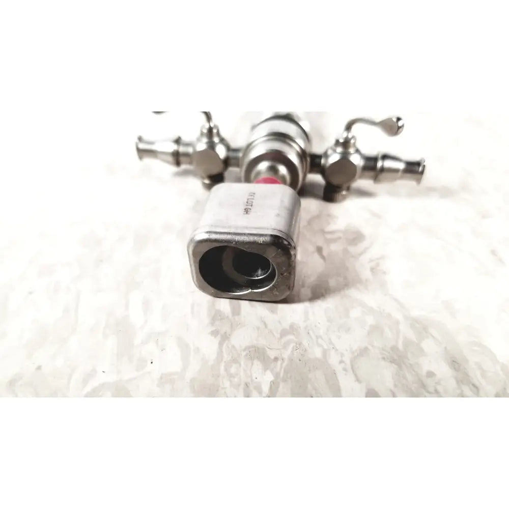 Silver metallic karl storz diagnostic arthro sheath faucet valve with square body and two side handles for arthroscopy